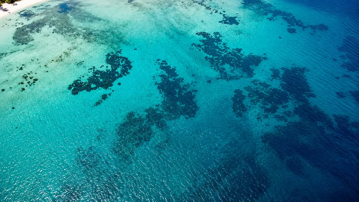 Aerial view of turquoise Mediterranean water at Alam Al Roum North Coast